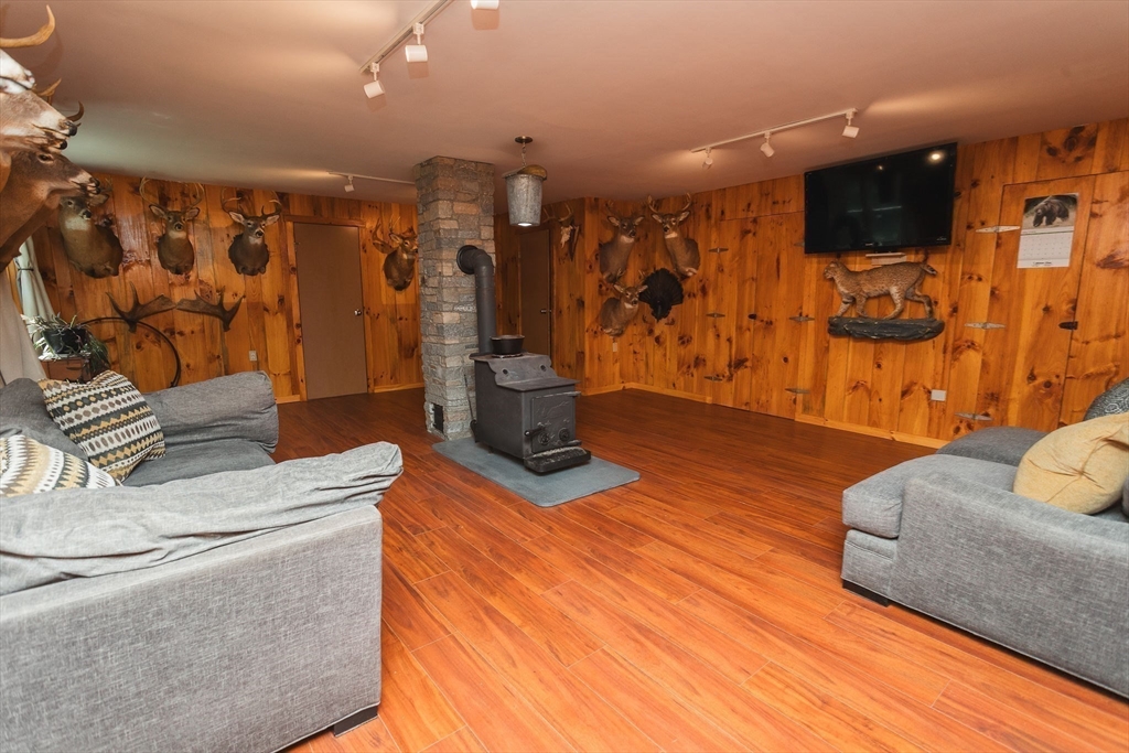 90 West Hawley Road Hawley, MA 01339 - Photo 25 of 34 a living room with furniture and a flat screen tv