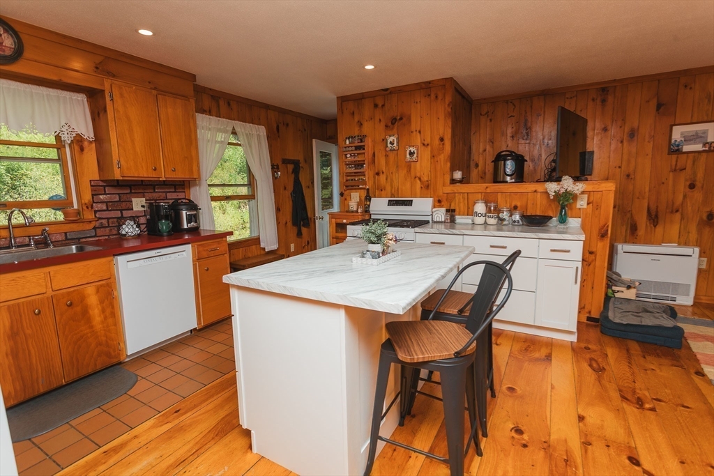90 West Hawley Road Hawley, MA 01339 - Photo 9 of 34 a kitchen with sink a stove and chairs