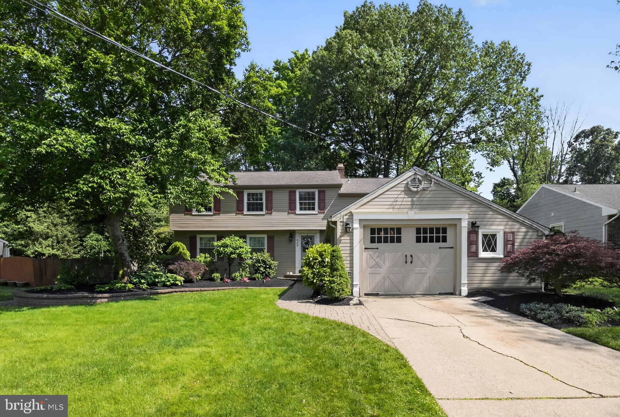 549 Covered Bridge Road Cherry Hill, NJ 08034 - Photo 2 of 16 a front view of a house with a garden