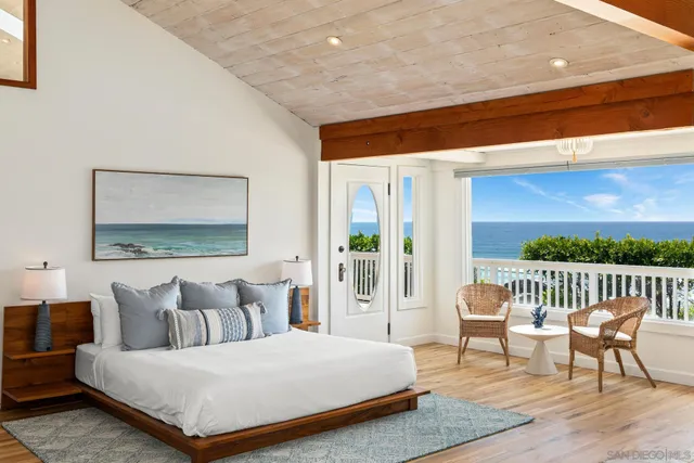a view of balcony with wooden floor and fence