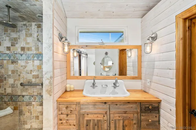 a kitchen with stainless steel appliances a stove a sink dishwasher and cabinets with wooden floor