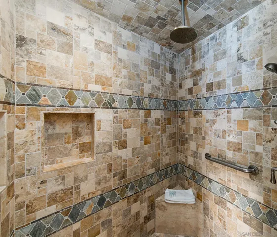 a bathroom with a bathtub shower sink vanity and a toilet
