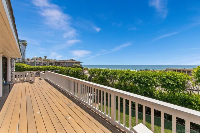a view of a chair and table in the balcony