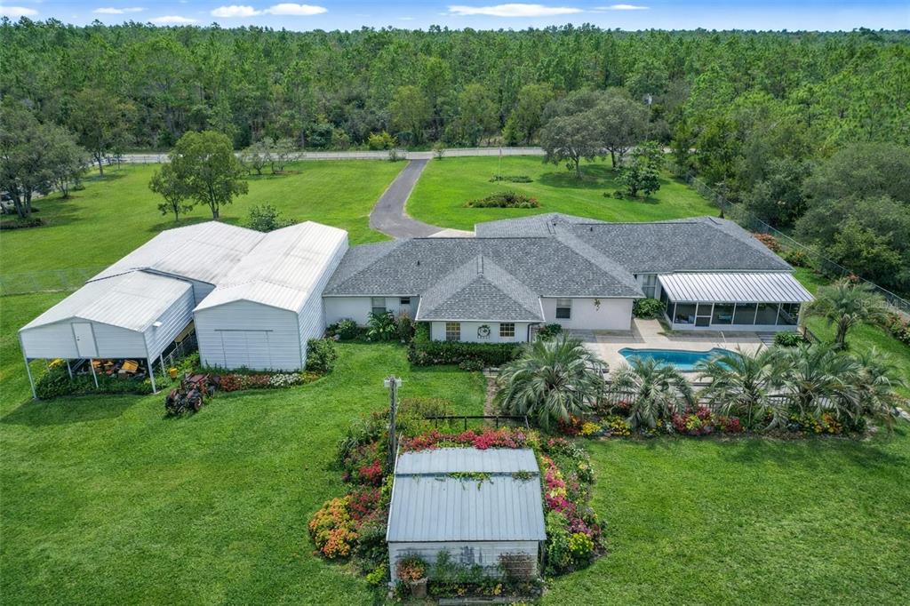 22163 Southwest Edgewater Boulevard Dunnellon, FL 34431 - Photo 14 of 78 an aerial view of a house with garden space and street view