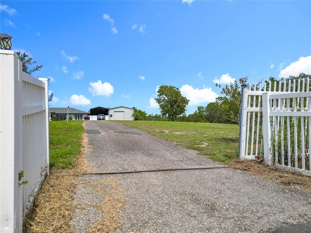 22163 Southwest Edgewater Boulevard Dunnellon, FL 34431 - Photo 19 of 78 a view of a porch with a yard