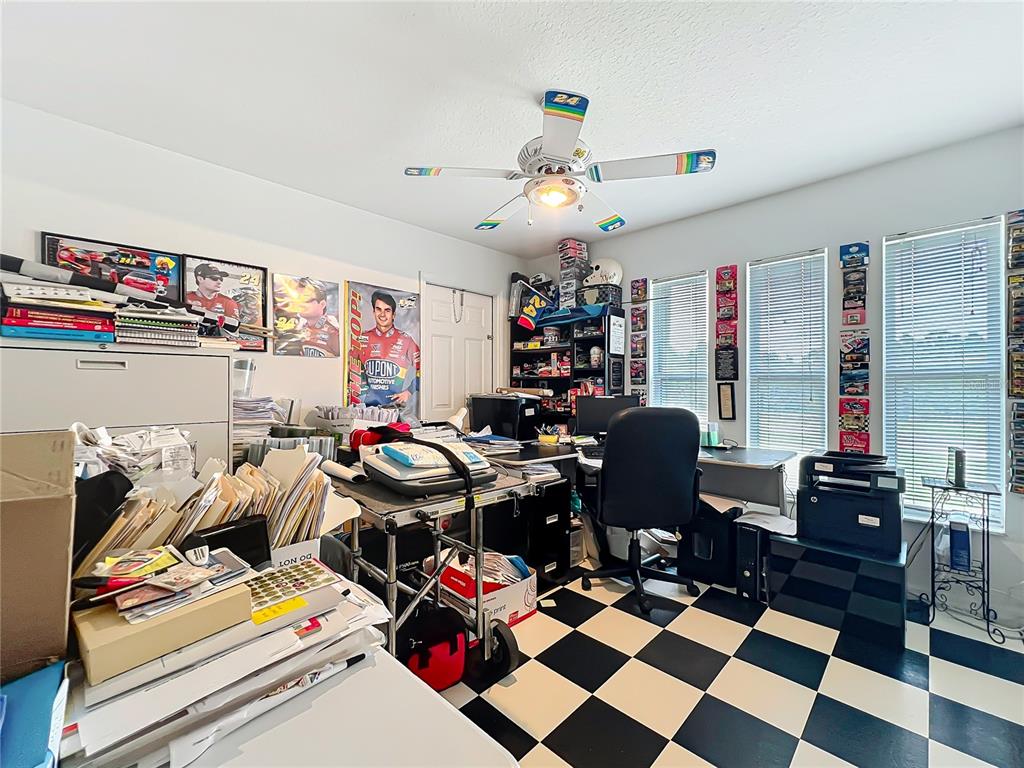 22163 Southwest Edgewater Boulevard Dunnellon, FL 34431 - Photo 27 of 78 a room with furniture and a chandelier