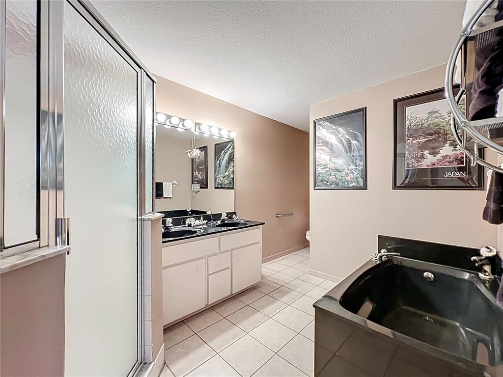 22163 Southwest Edgewater Boulevard Dunnellon, FL 34431 - Photo 38 of 78 a kitchen with granite countertop a stove a sink and a refrigerator