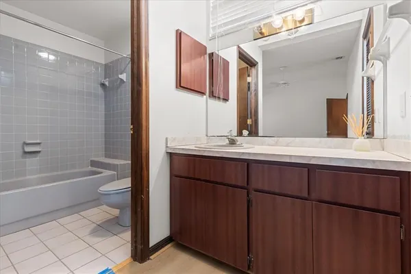 a bathroom with a bathtub a sink and a toilet