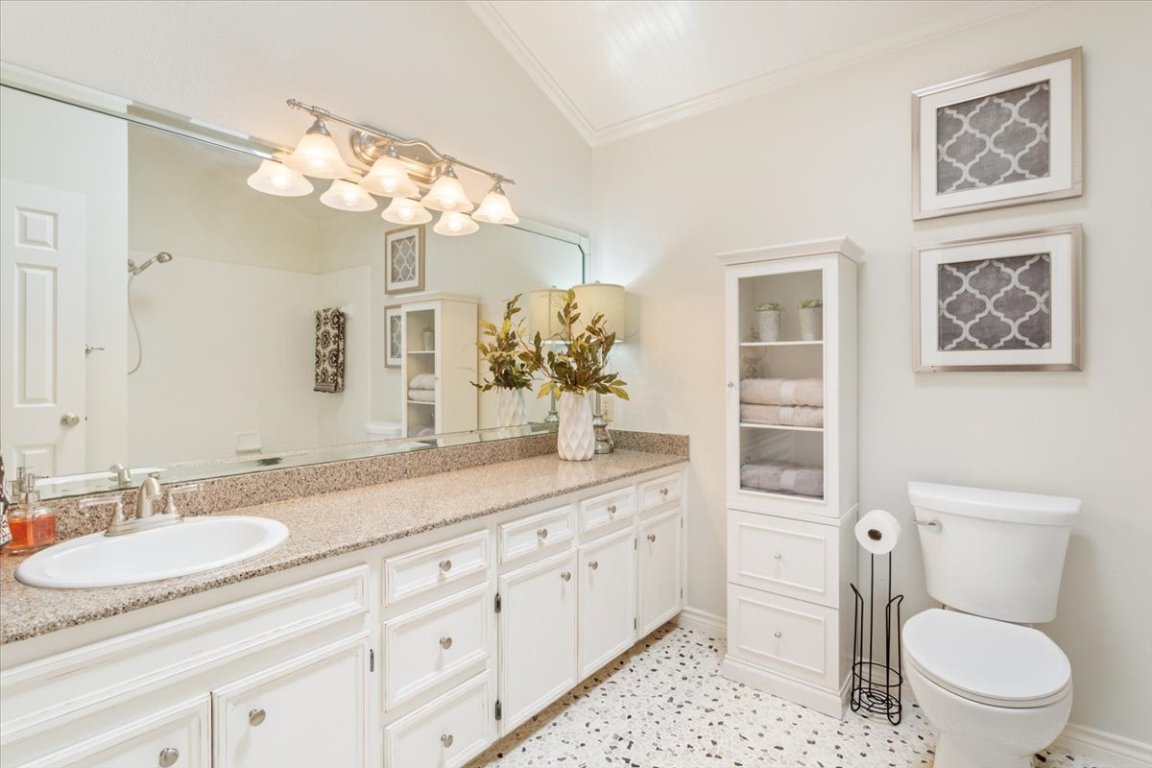 2217 Stagecoach Trail Temple, TX 76502 - Photo 28 of 39 a bathroom with a granite countertop sink a toilet and a mirror