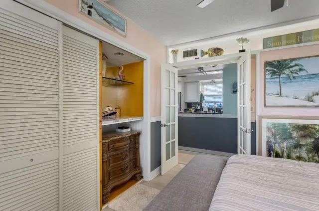 a living room with furniture a window and a flat screen tv