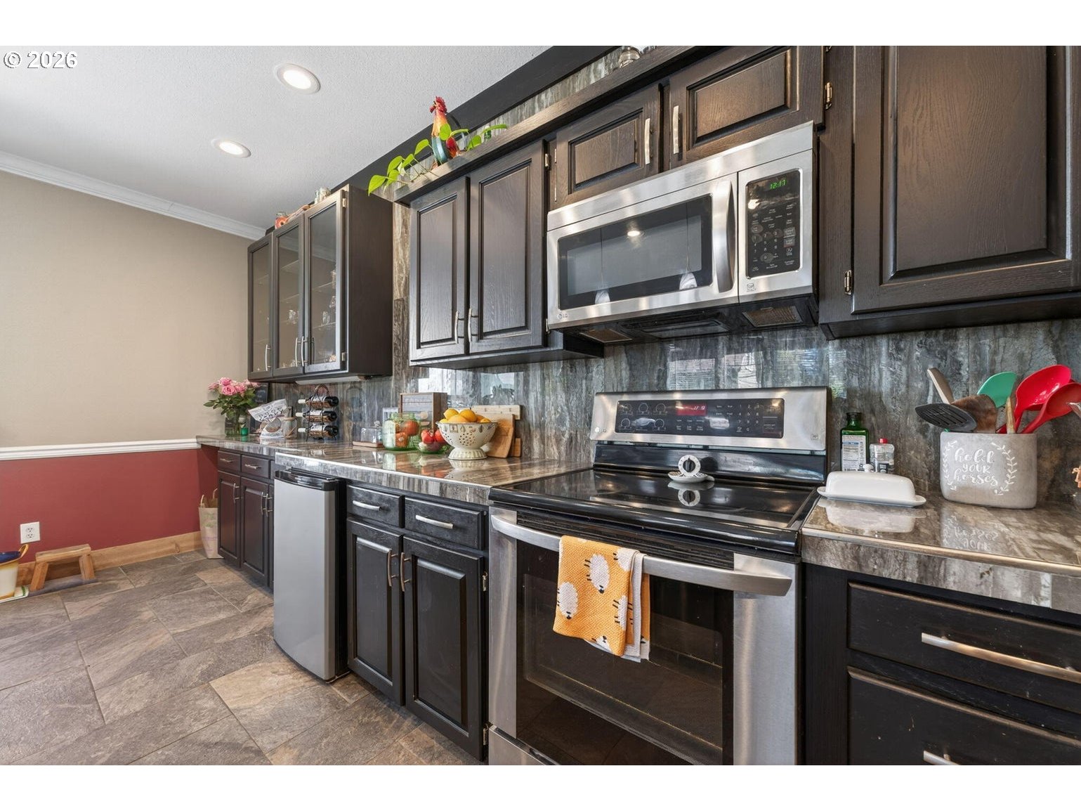 538 North Tam Rim Drive Sisters, OR 97759 - Photo 16 of 45 a kitchen with stainless steel appliances granite countertop a sink stove and microwave