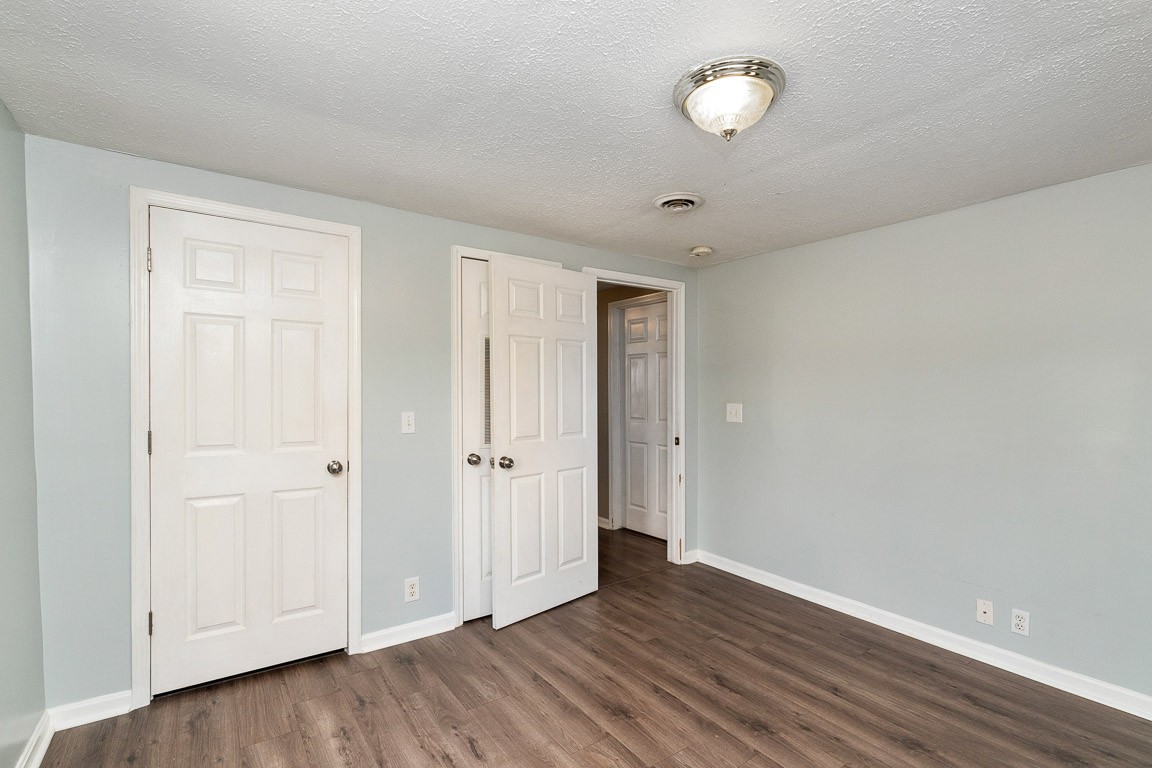 425 Keysburg Road Adams, TN 37010 - Photo 27 of 45 a view of an empty room with wooden floor and closet