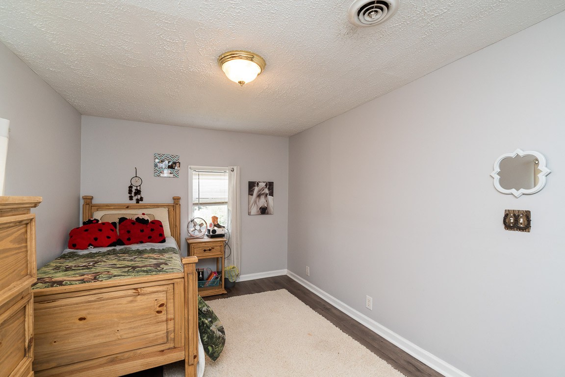 425 Keysburg Road Adams, TN 37010 - Photo 29 of 45 a view of a bedroom with baby bed