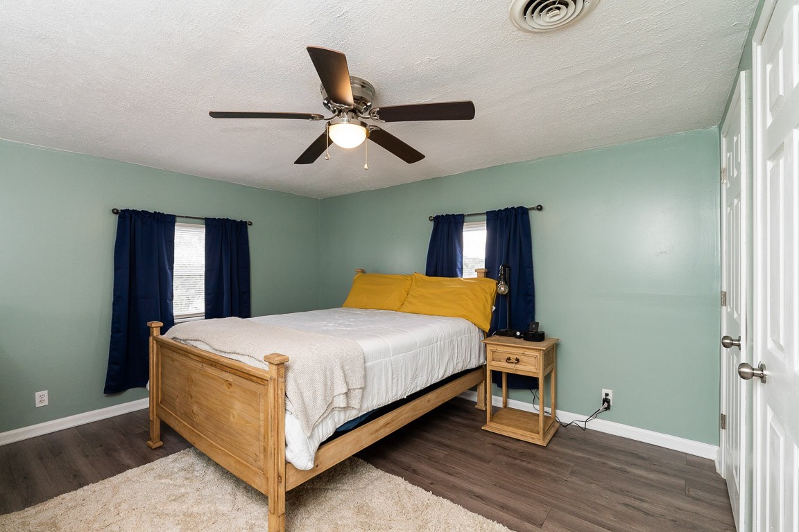 425 Keysburg Road Adams, TN 37010 - Photo 34 of 45 a bedroom with a bed and wooden floor