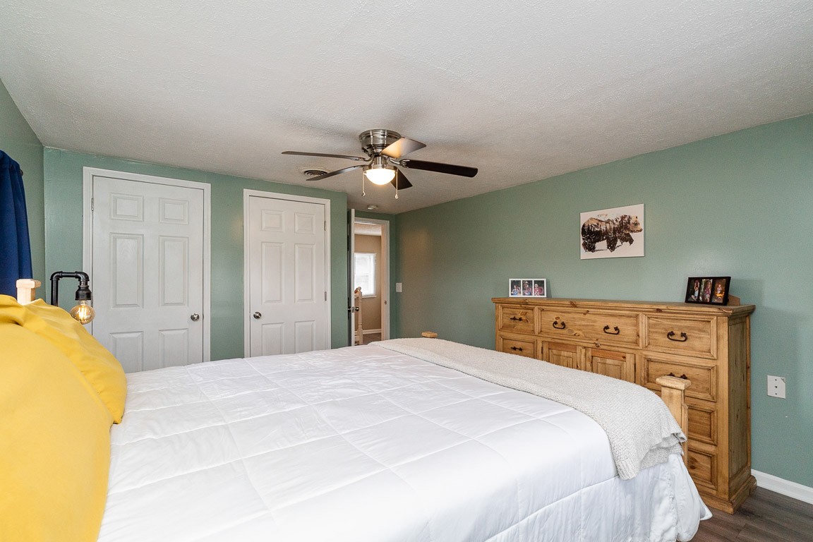 425 Keysburg Road Adams, TN 37010 - Photo 36 of 45 a bedroom with a bed and a chandelier