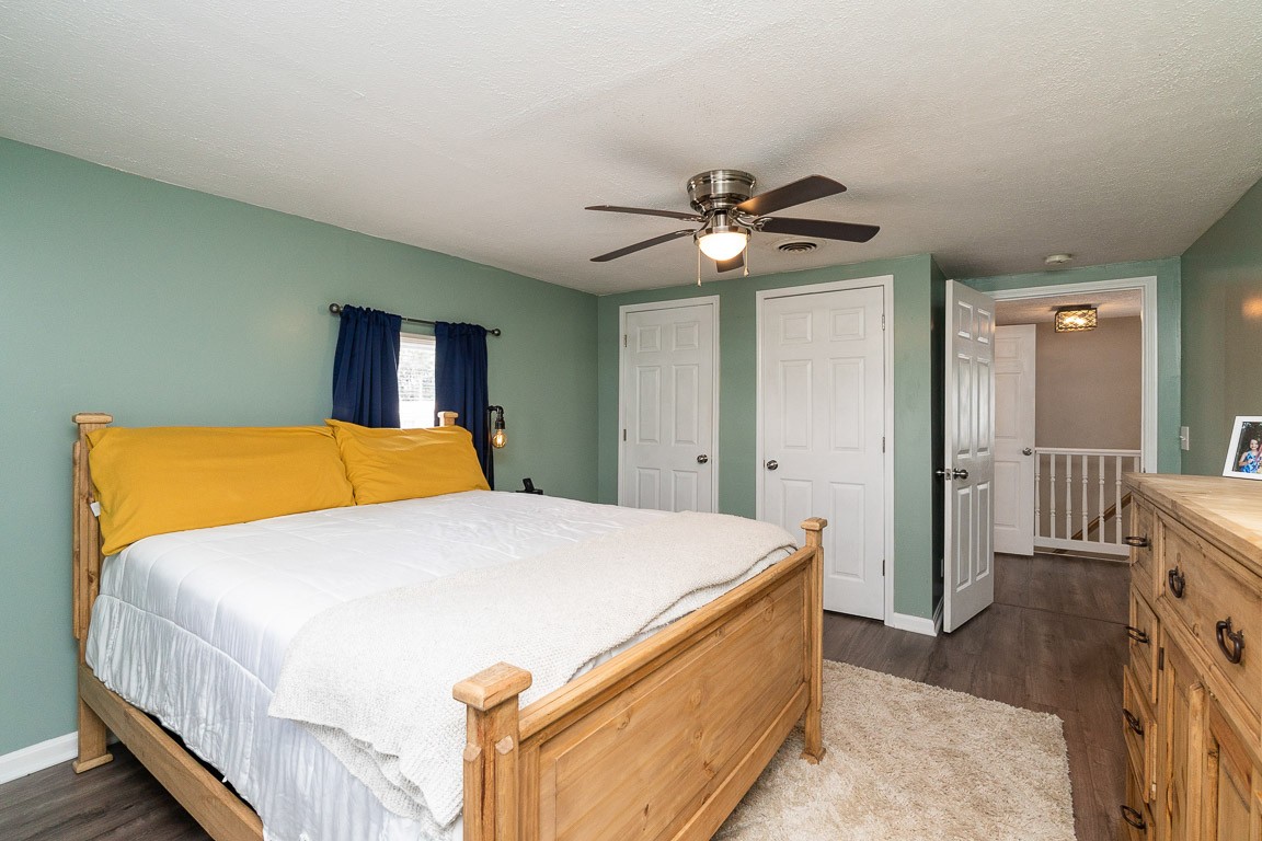 425 Keysburg Road Adams, TN 37010 - Photo 37 of 45 a bed room with a bed and a chandelier