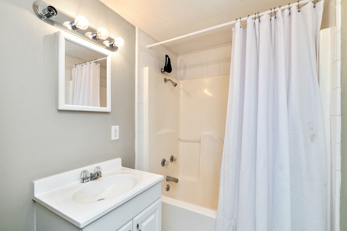 425 Keysburg Road Adams, TN 37010 - Photo 38 of 45 a bathroom with a shower a sink and a mirror