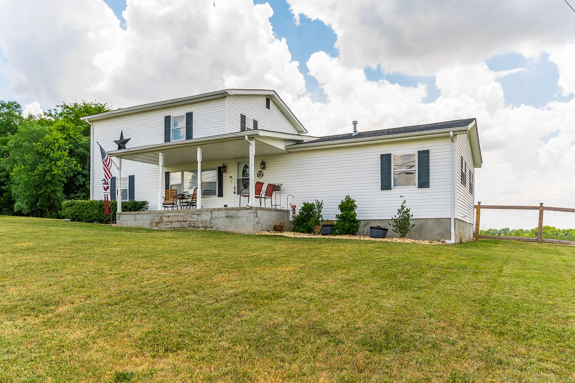 425 Keysburg Road Adams, TN 37010 - Photo 45 of 45 a front view of house with yard having outdoor seating