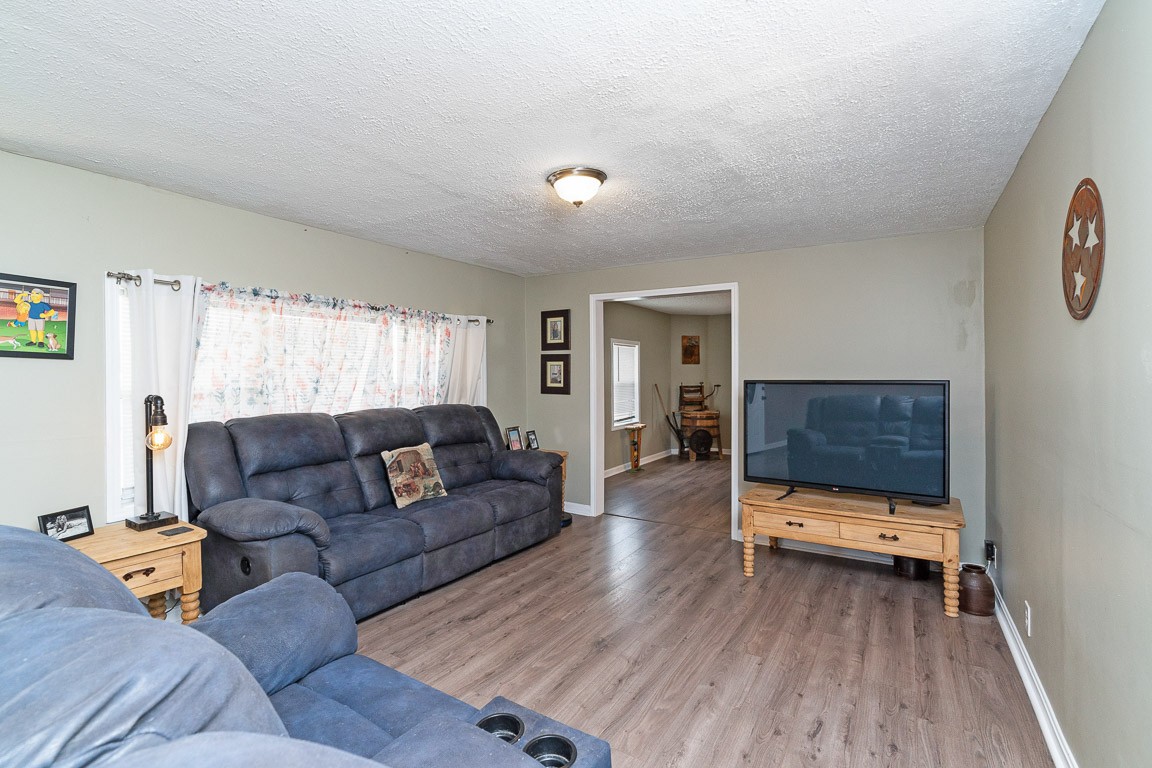 425 Keysburg Road Adams, TN 37010 - Photo 6 of 45 a living room with furniture and a gate