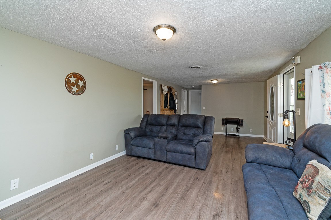 425 Keysburg Road Adams, TN 37010 - Photo 8 of 45 a living room with furniture and a window