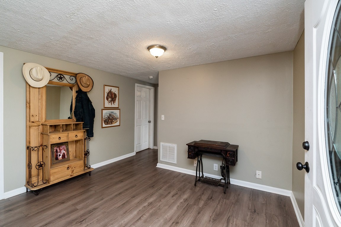425 Keysburg Road Adams, TN 37010 - Photo 9 of 45 a room with furniture and wooden floor