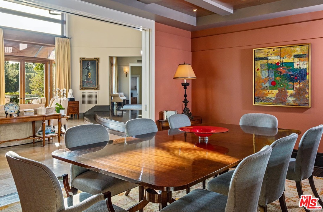 1870 Mango Way Los Angeles, CA 90049 - Photo 11 of 28 a view of a dining room with furniture a rug and wooden floor