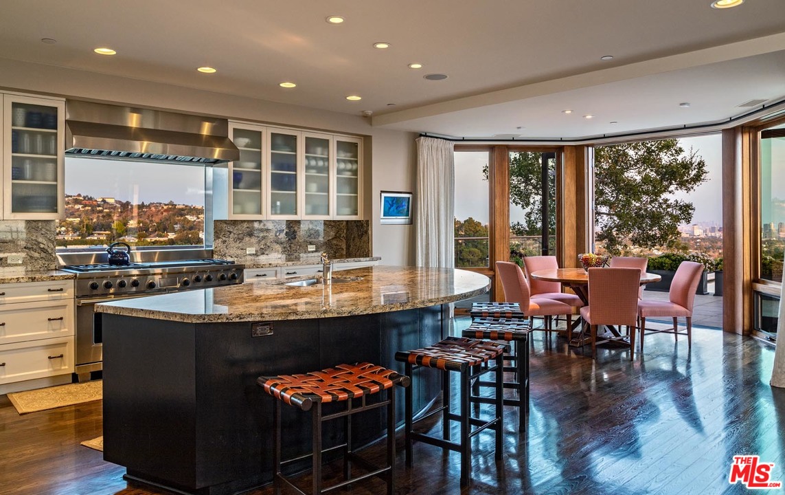 1870 Mango Way Los Angeles, CA 90049 - Photo 13 of 28 a dining table with chairs in front of it