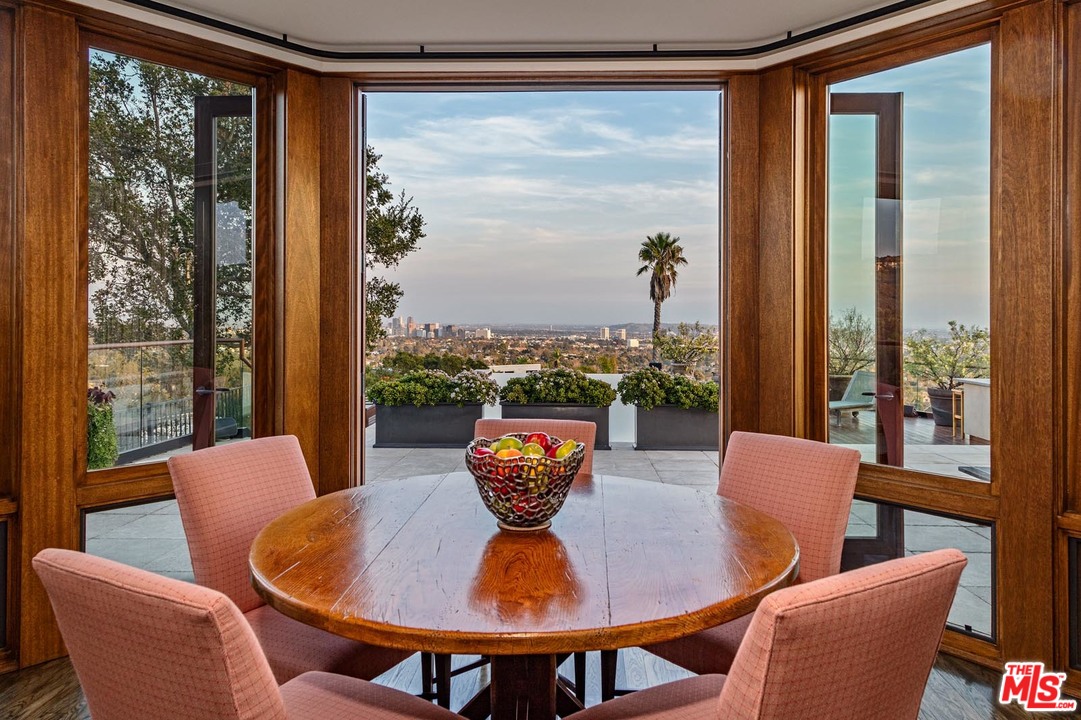 1870 Mango Way Los Angeles, CA 90049 - Photo 14 of 28 a view of a dining room with furniture window and outside view