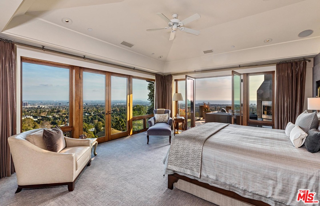 1870 Mango Way Los Angeles, CA 90049 - Photo 18 of 28 a bedroom with a bed and large windows