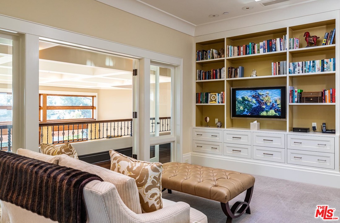 1870 Mango Way Los Angeles, CA 90049 - Photo 19 of 28 a living room with furniture and a flat screen tv