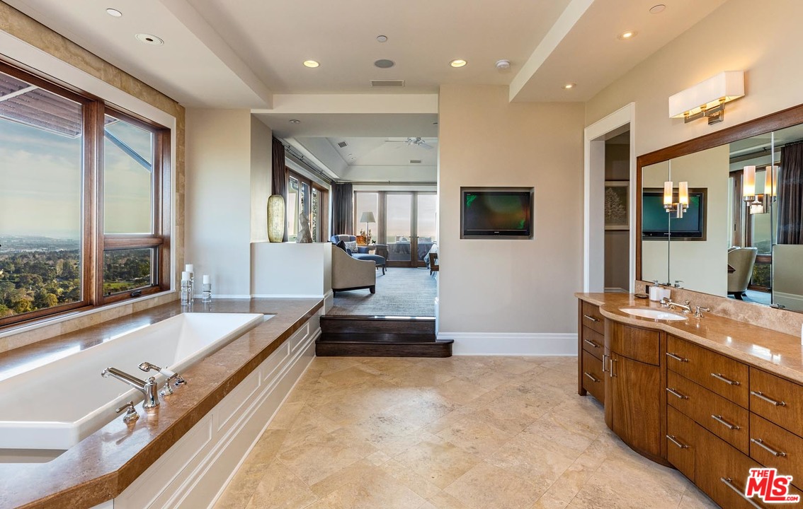 1870 Mango Way Los Angeles, CA 90049 - Photo 20 of 28 a spacious bathroom with a large tub and sink