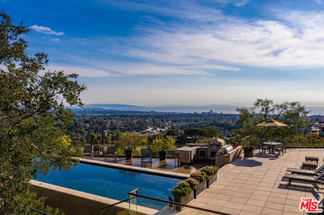 1870 Mango Way Los Angeles, CA 90049 - Photo 5 of 28 a view of a terrace with chairs