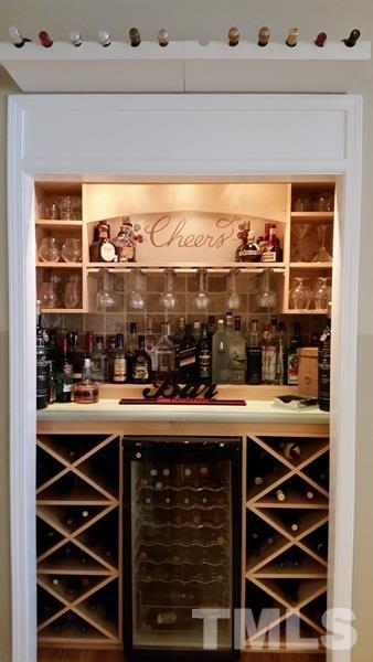 5435 Brandy Bay Road Raleigh, NC 27613 - Photo 15 of 25 Great feature - comes with wine cooler, illuminated bar top, hanging glass rack with additional wine storage