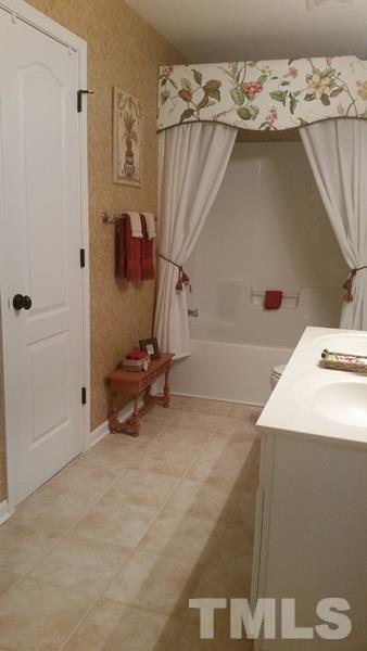 5435 Brandy Bay Road Raleigh, NC 27613 - Photo 16 of 25 Dual vanity sinks w/tile flooring, Full Bath