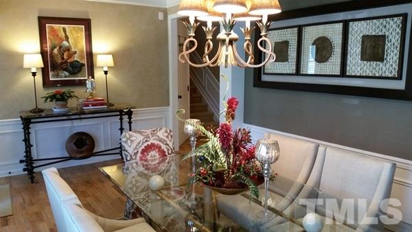 5435 Brandy Bay Road Raleigh, NC 27613 - Photo 3 of 25 Custom paint, tray ceiling, access to foyer with crown molding, wainscott