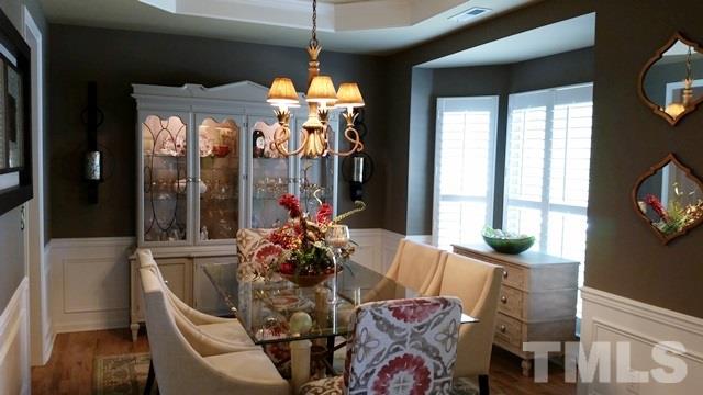 5435 Brandy Bay Road Raleigh, NC 27613 - Photo 7 of 25 Tray Ceiling, Bay Window, Plantation Shutters, Wainscott, Hardwood Floors, Upgraded Lighting