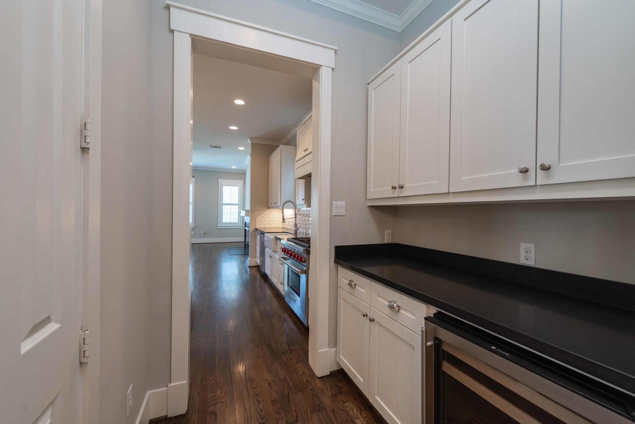 734 Allston Street, Unit B Houston, TX 77007 - Photo 6 of 28 Plenty of cabinets, small frig and walk in pantry are located here in Butlers Pantry,