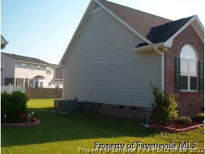 3533 Talus Road Fayetteville, NC 28306 - Photo 4 of 7 a view of a house with a yard