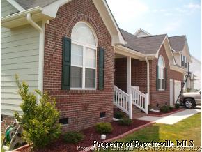 3533 Talus Road Fayetteville, NC 28306 - Photo 7 of 7 a view of a brick house with many windows