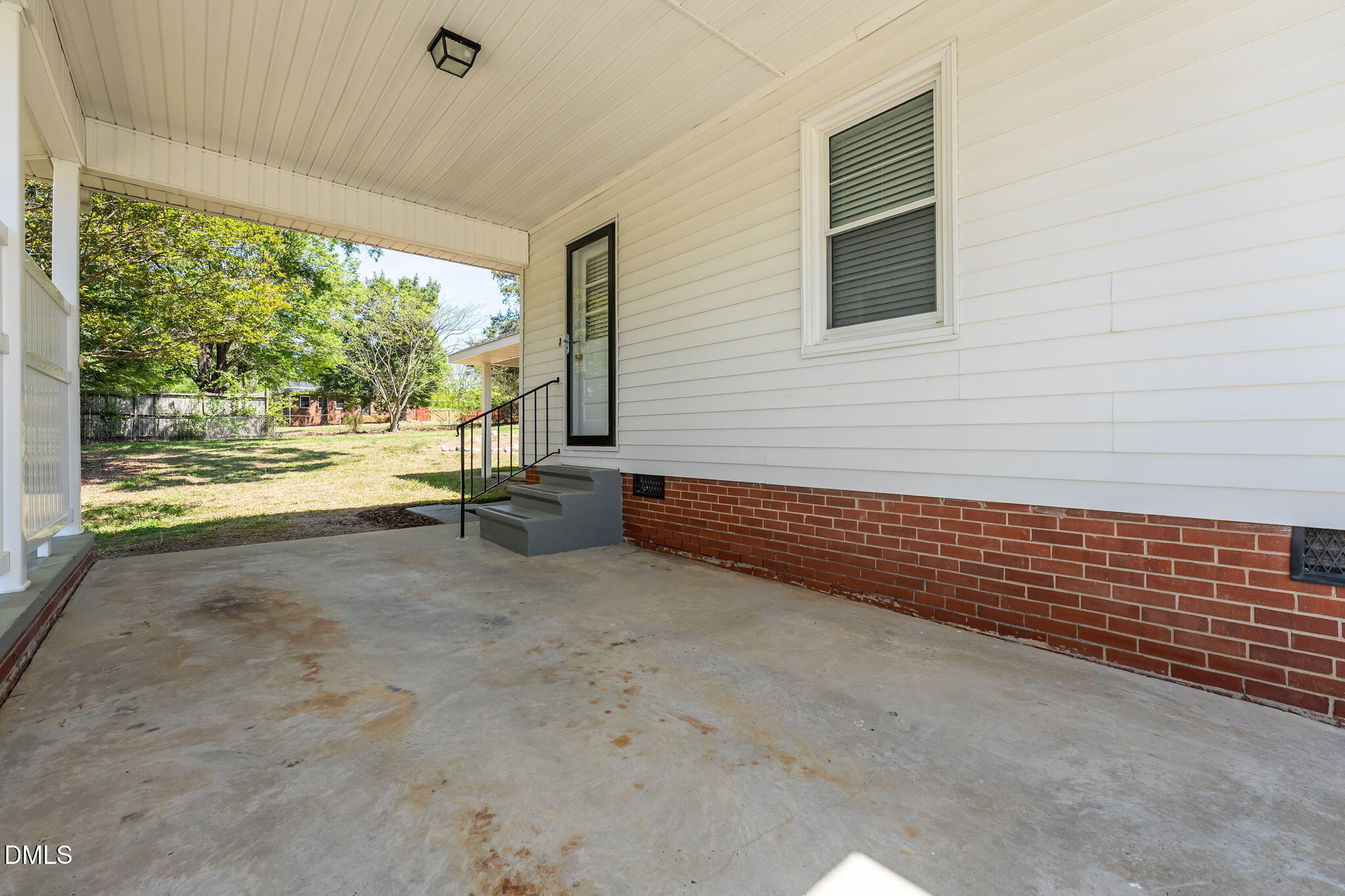 1723 Power Line Road Elon, NC 27244 - Photo 19 of 22 a view of a room with wooden floor and a large window