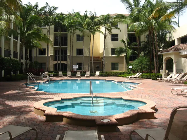 a swimming pool with outdoor seating and yard