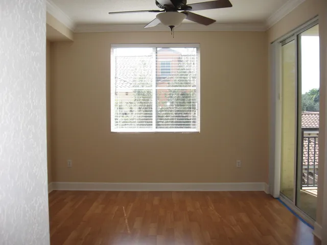 a view of an empty room with a window