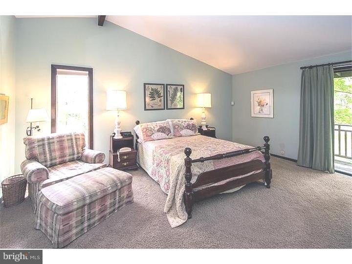 1501 Gypsy Hill Road Lower Gwynedd, PA 19002 - Photo 12 of 24 a bedroom with a bed and a night stand