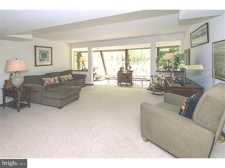 1501 Gypsy Hill Road Lower Gwynedd, PA 19002 - Photo 14 of 24 a living room with furniture and a large window
