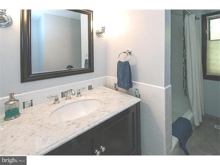 1501 Gypsy Hill Road Lower Gwynedd, PA 19002 - Photo 16 of 24 a bathroom with a sink vanity and a mirror