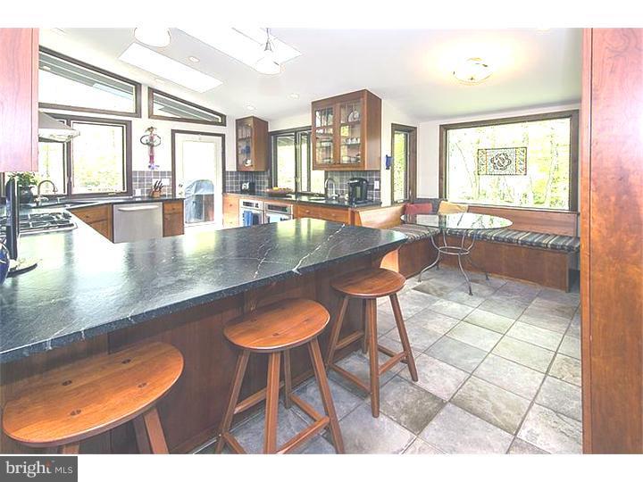 1501 Gypsy Hill Road Lower Gwynedd, PA 19002 - Photo 9 of 24 a dining room with furniture and a floor to ceiling window