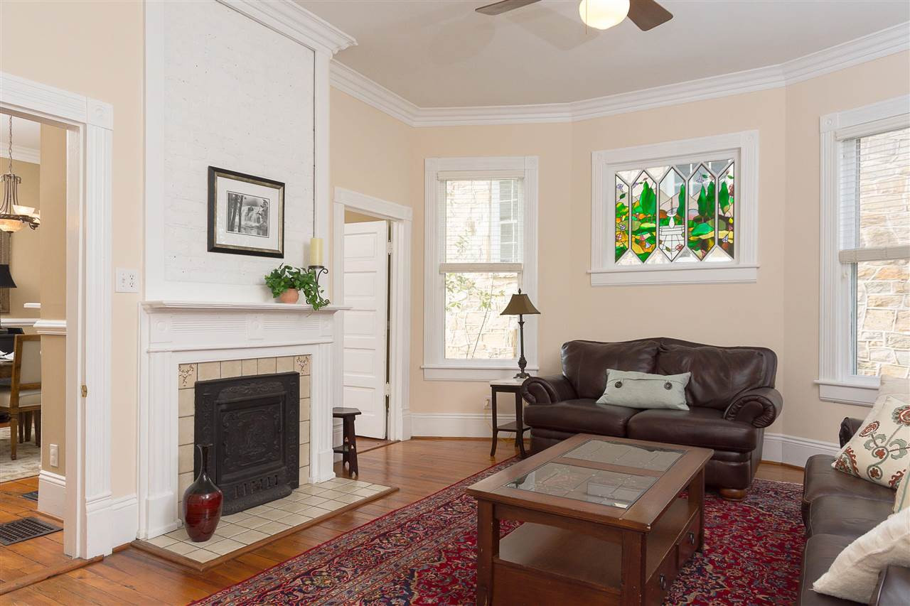 316 North Boundary Street Raleigh, NC 27604 - Photo 12 of 23 a living room with furniture a window and a fireplace