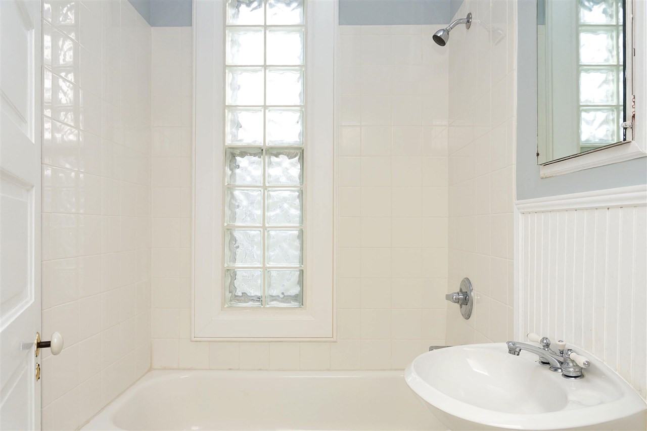 316 North Boundary Street Raleigh, NC 27604 - Photo 14 of 23 a bathroom with a bathtub a shower and a sink