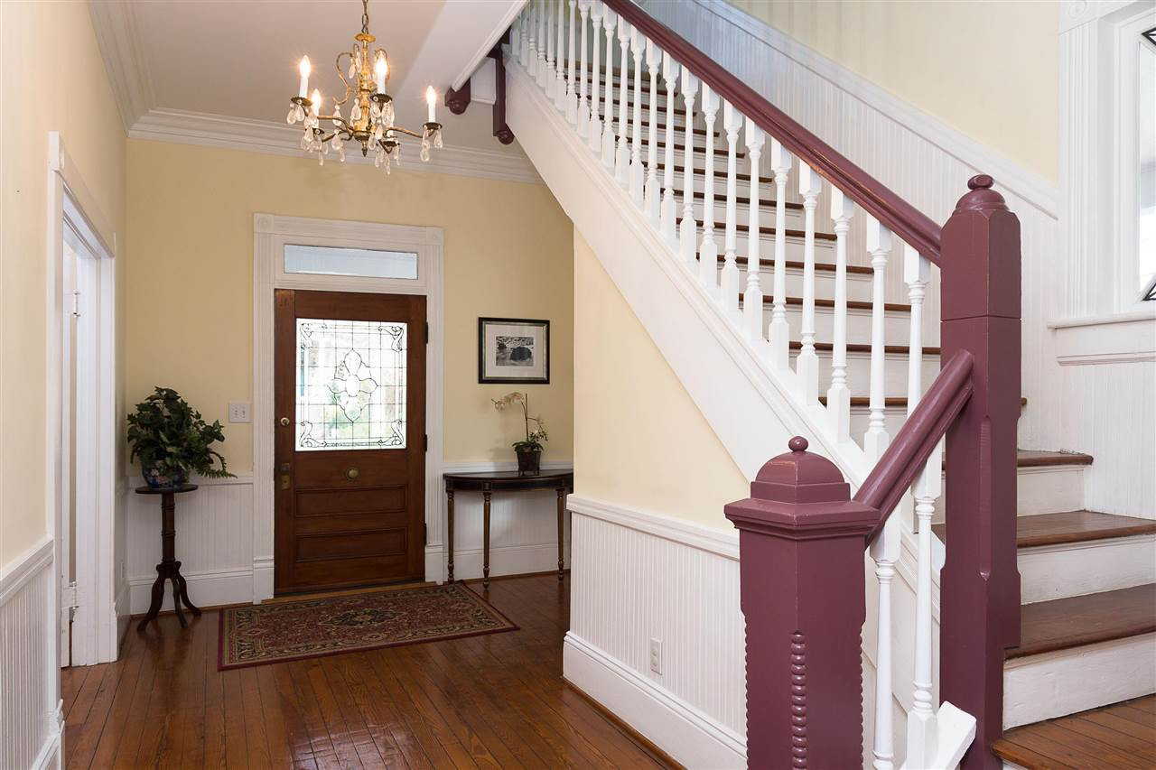 316 North Boundary Street Raleigh, NC 27604 - Photo 4 of 23 a view of entryway with wooden floor and a chandelier