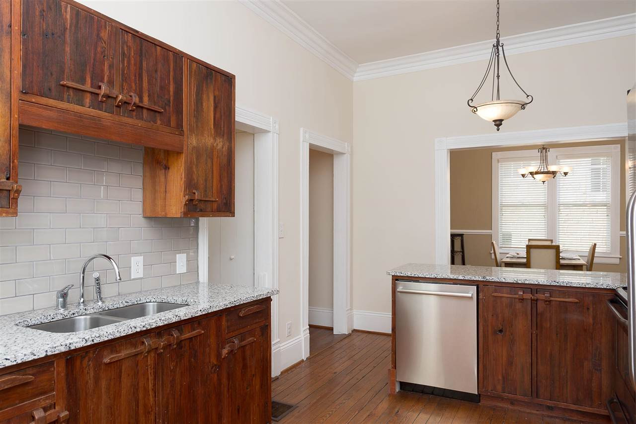 316 North Boundary Street Raleigh, NC 27604 - Photo 6 of 23 a kitchen with stainless steel appliances granite countertop a sink a stove and a refrigerator